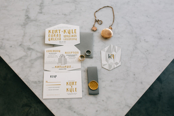 <img src="//cdn.shopify.com/s/files/1/2683/3718/files/KK_03_1024x1024.jpg?v=1519227629" alt="Kurt &amp; Kyle's diecut foldout wedding invitation on And Here We Are" />