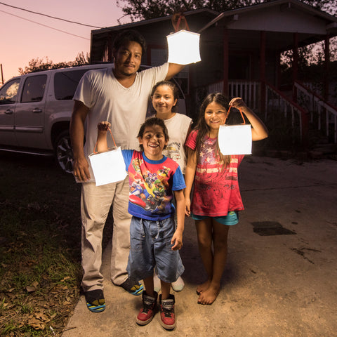 Family holding lanterns.