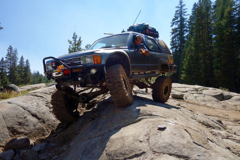 Marty's first gen toyota 4runner on the second obstacle on slick rock