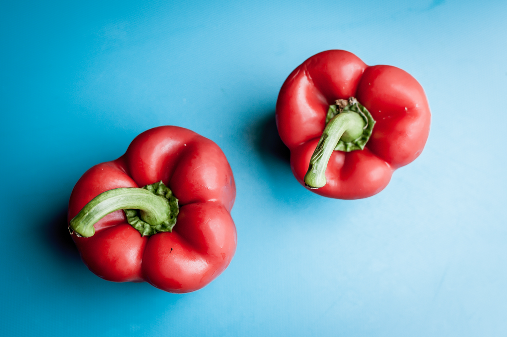 red bell peppers on a blue background