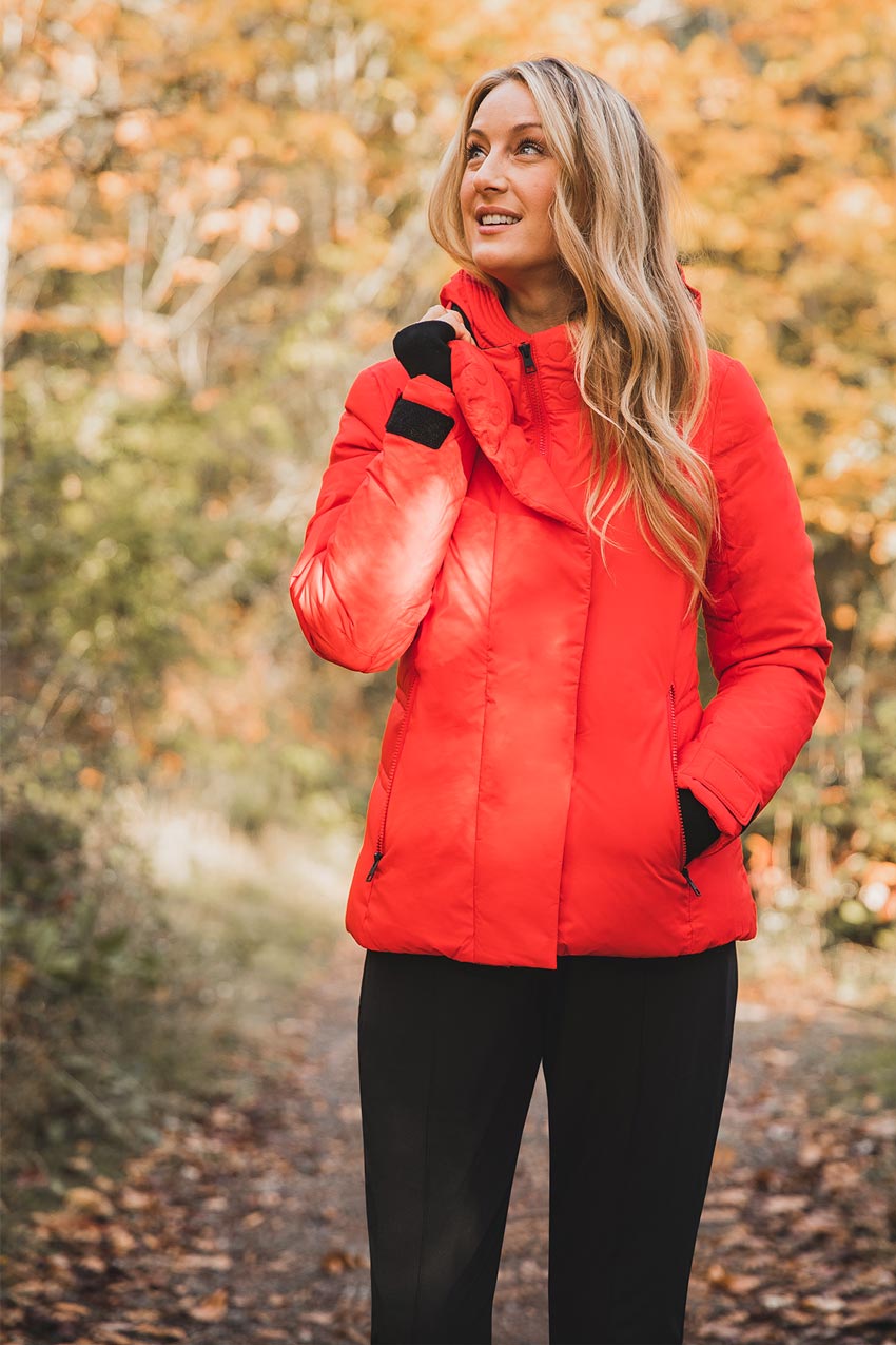 Chelsea Williams in the outdoors wearing a red MPG jacket