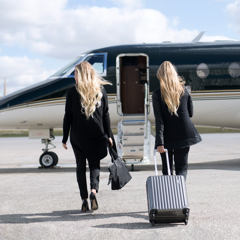 Ashley and Jenna boarding a private jet