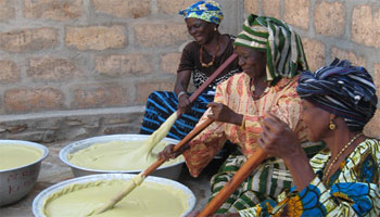 Women making Shea Butter