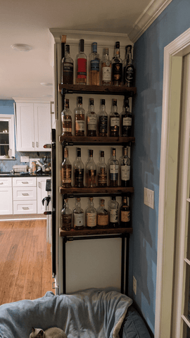 DIY whiskey shelf made out of reclaimed wood