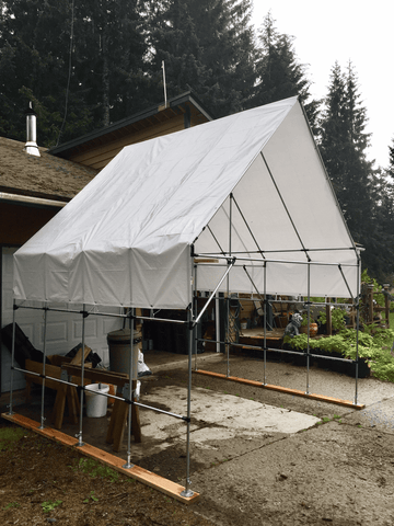 DIY rain shelter with tarp roof