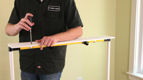 Threading the screw into the shelf