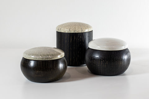Ebonised walnut with Raku lidded containers, by Kate Schuricht, available at Padstow Gallery, Cornwall