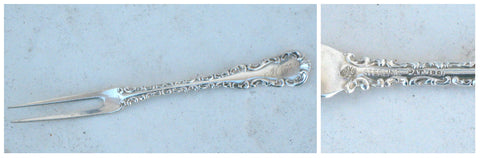 Sterling silver pickle fork with ornate scroll detail front and backside with sterling marking.