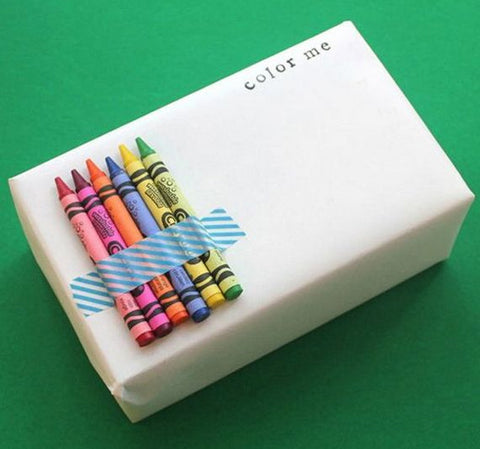 Wrapped present with crayons attached