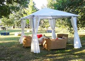 Cosy white gazebo tent in the garden