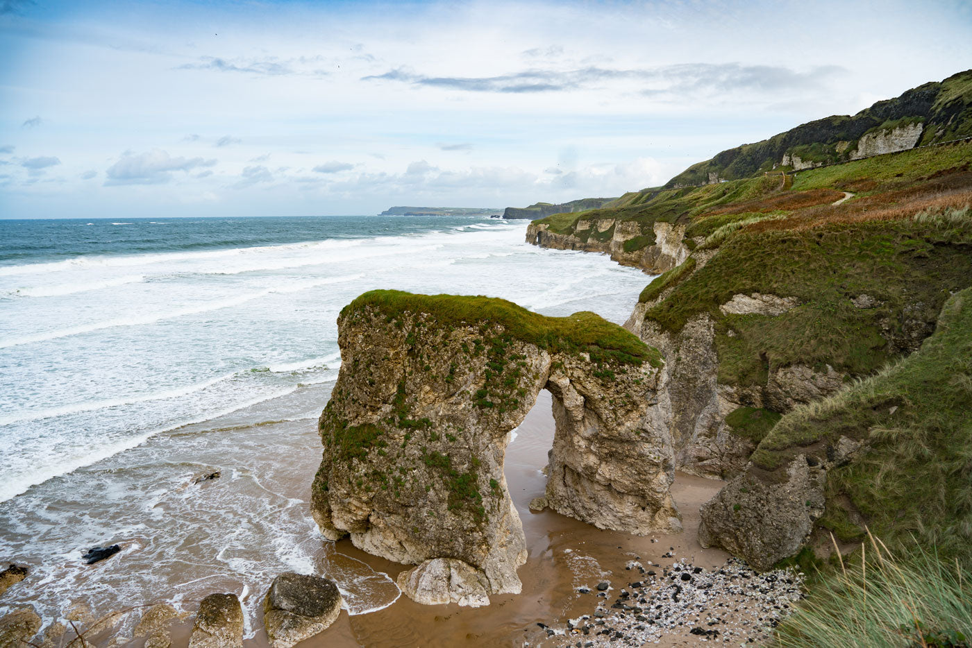 Rugged cliffs and emerald green fields make the Causeway Coast a dramatic and mesmerising beauty spot