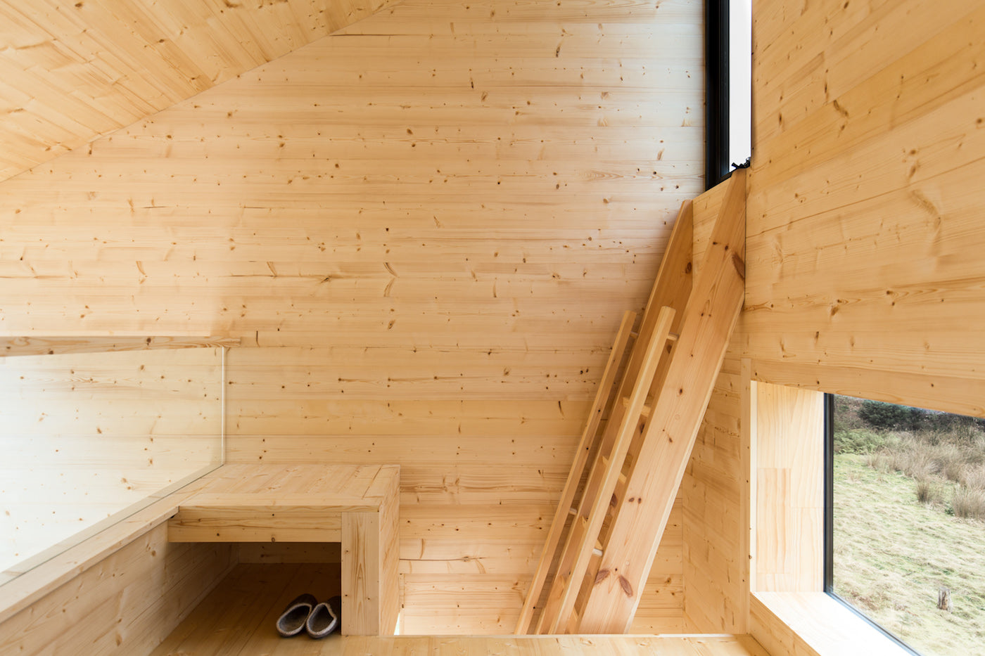 Above the living space is a sleeping loft. Campers can climb a timber ladder to reach the sleeping area. (Photo: Rob Maver)