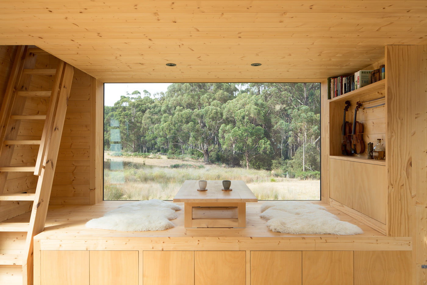 A low table is set on a platform. Sheep fur are placed on the floor as seating. (Photo: Rob Maver)