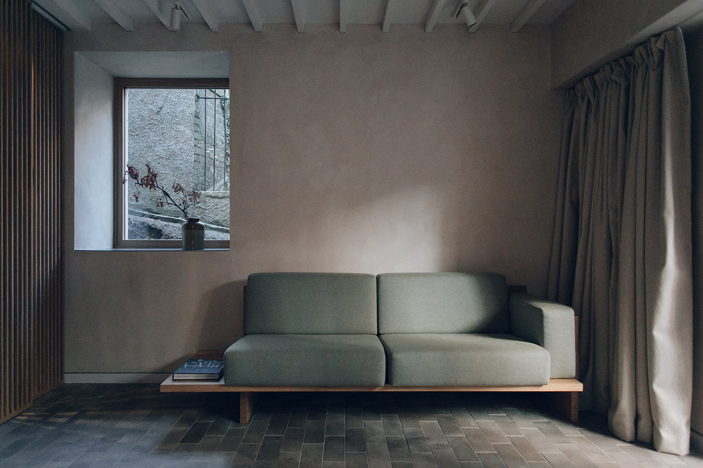 Frontal shot of a couch in a studio designed by Izat and Arundell in Edinburgh. (Photo: Haarkon)