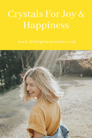 Crystals For Joy & Happiness Woman Wearing Yellow T Shirt Smiling In Rays Of Sunshine