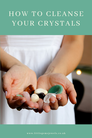 How to cleanse your crystals women holding handful of crystals