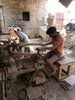 wood carver making mango wood bowls 