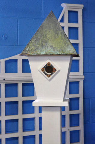 A Pad With A Patina Birdhouse