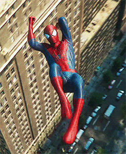 Spider-Man swinging from buildings, doing what he does best!
