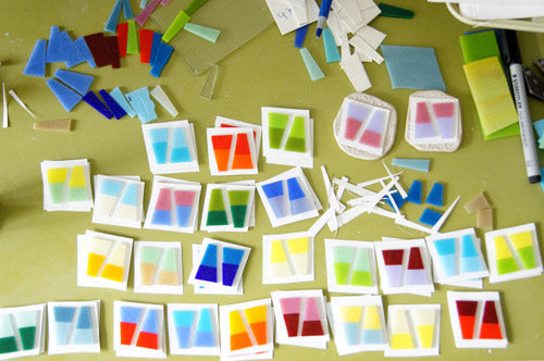 preparing glass earring pieces to fire in kiln