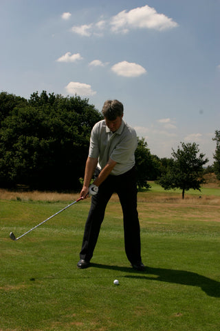 David Wilkinson swinging his golf club back.