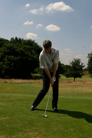 David Wilkinson hitting a golf ball.