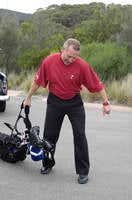 Ramsay McMaster Dragging golf bag and clubs along the ground