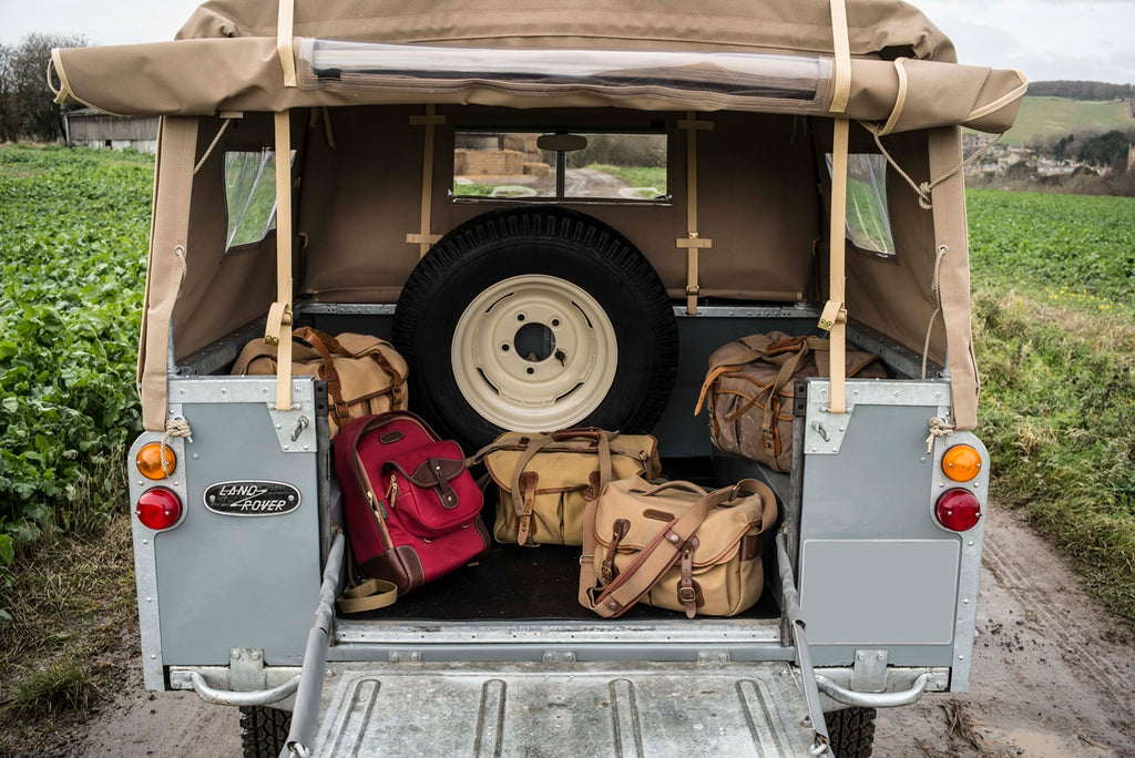 1964 Series 2a Land Rover, Billingham Rucksack 35 in Burgundy Canvas and Chocolate Leather (front left), Billingham Hadley Pro bag (front right), 550 bag, Billingham 225 bag and old Billingham System bag.