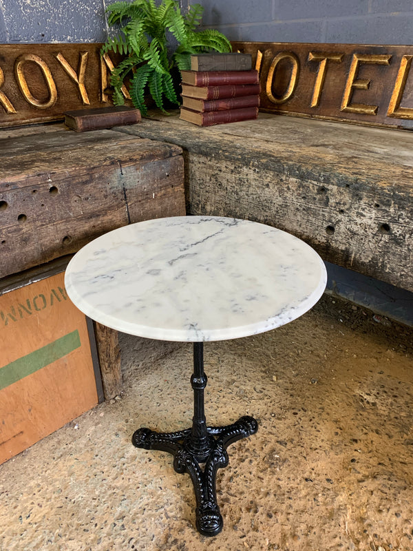 marble and cast iron bistro table