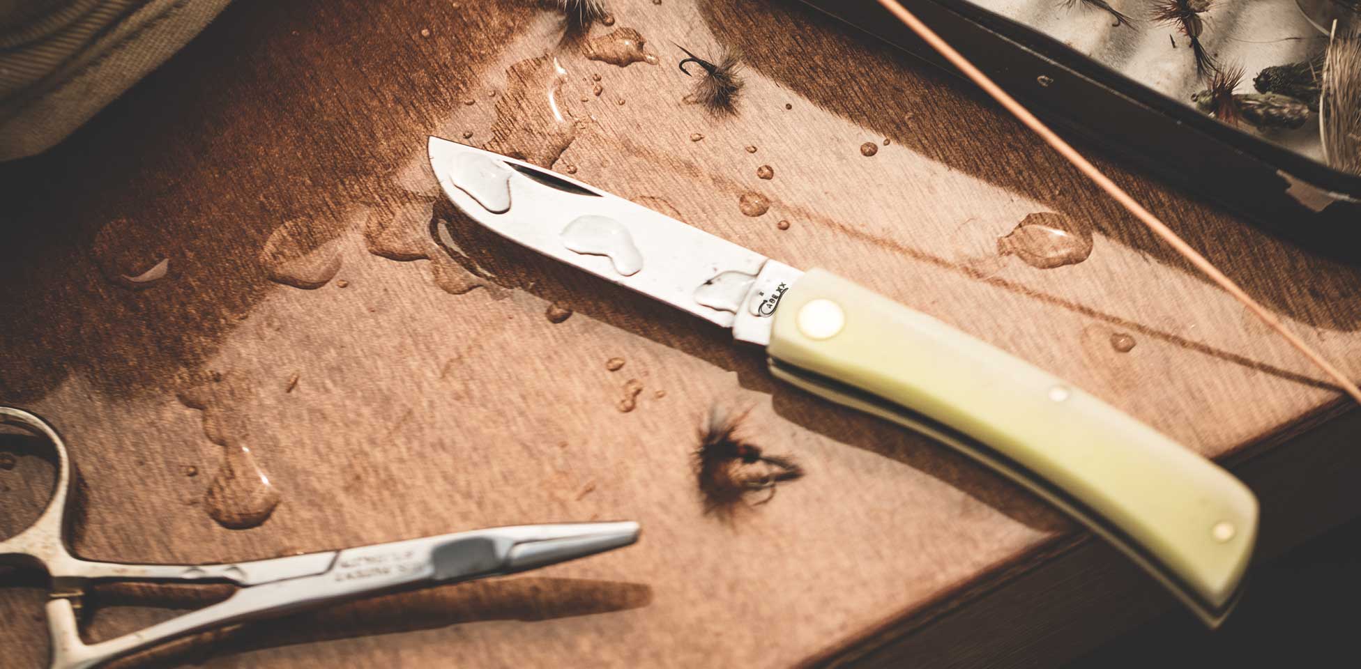 Case Sod Buster(R) knife in boat surrounded by fishing gear