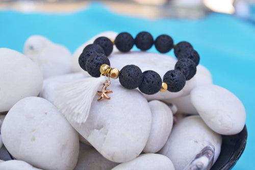 lava stone bead bracelet on rocks
