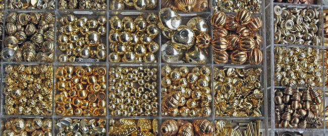 collection of metal beads in box
