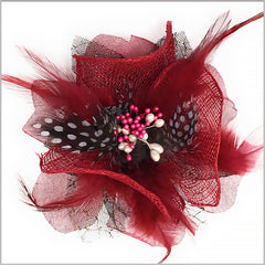 burgundy lapel flower with feather