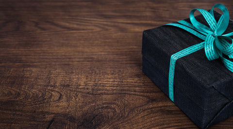 wrapped present with teal ribbon