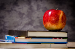 School books with apple on Kindergarten Registration blog