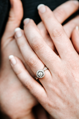 diamond engagement ring on woman's hand
