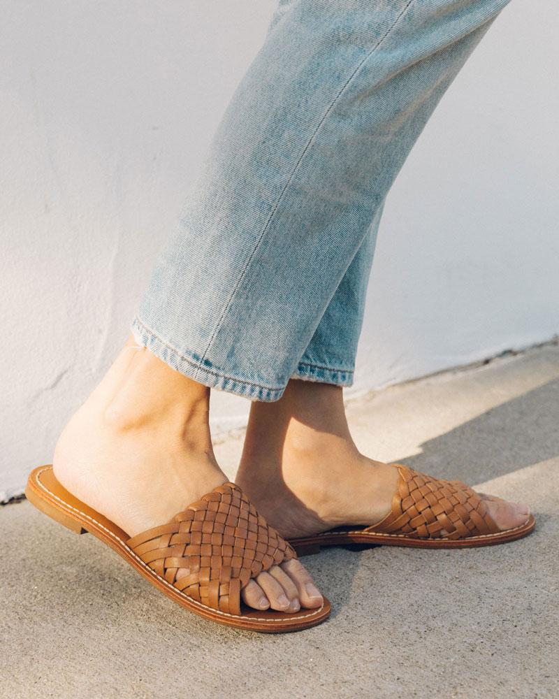 tan woven leather slides