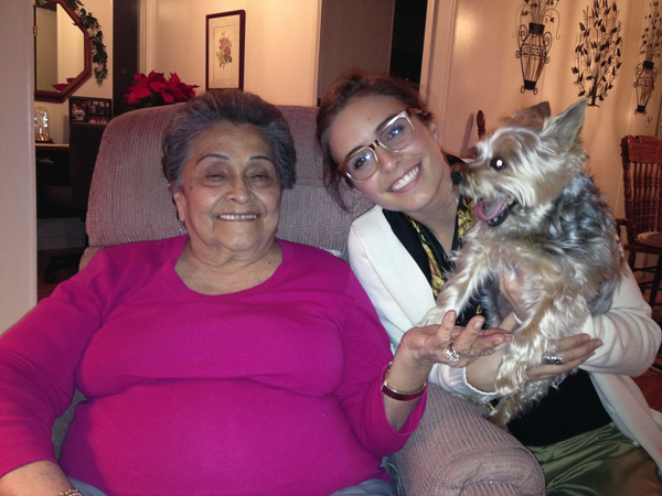 a grandma and her granddaughter and a small dog