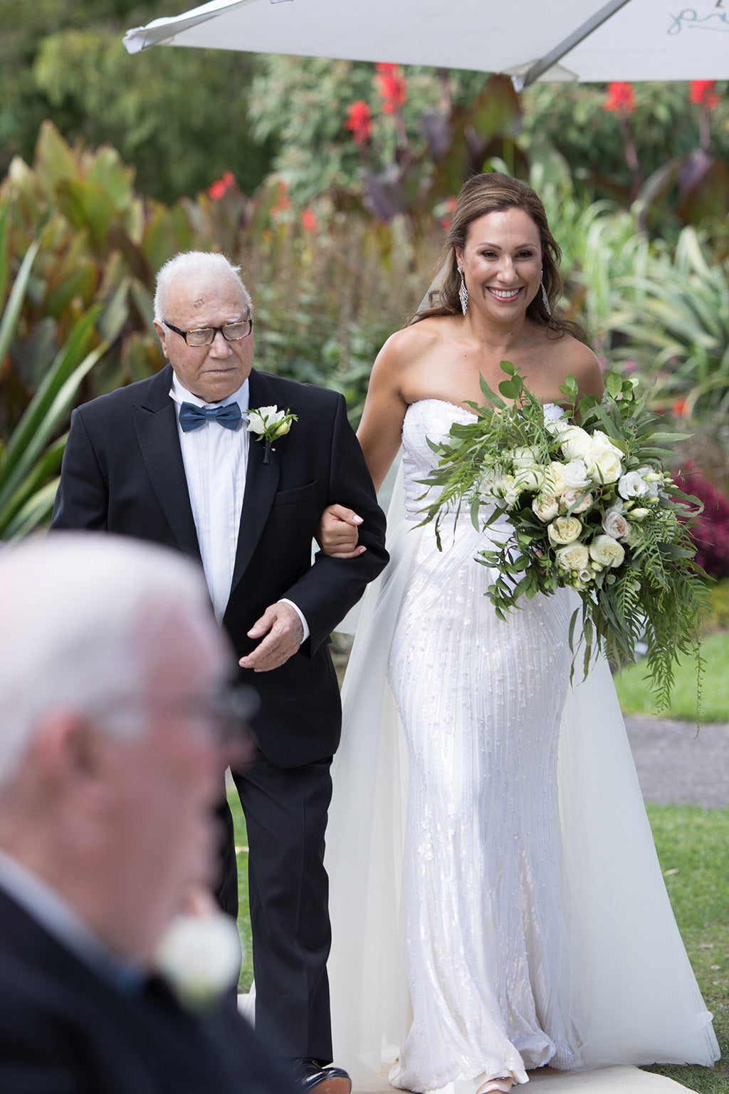 Bride walking down the isle with her father at wedding