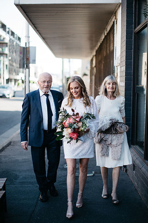 Bride walking with Wedding Flowers