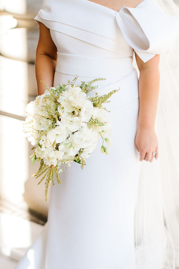 Bride holding bridal bouquet wedding flowers