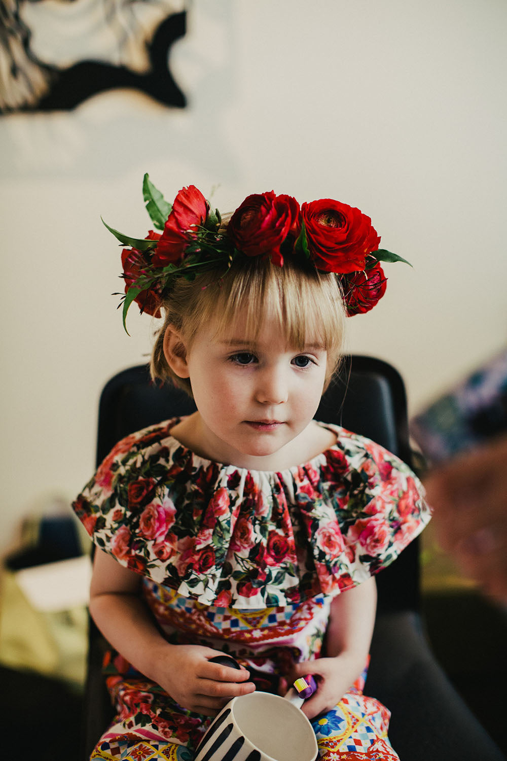 Young girl with red flower crown 