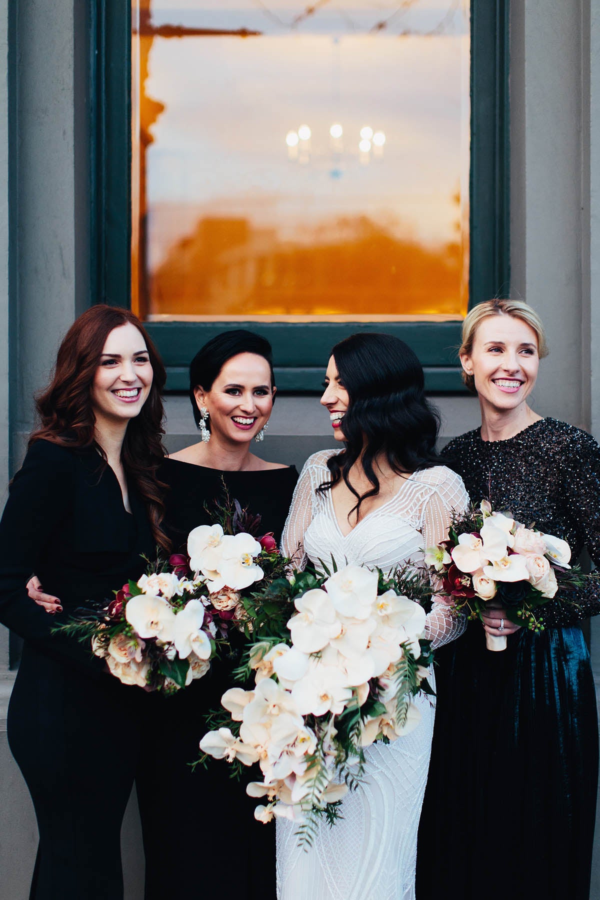 Bridal party holding wedding flowers
