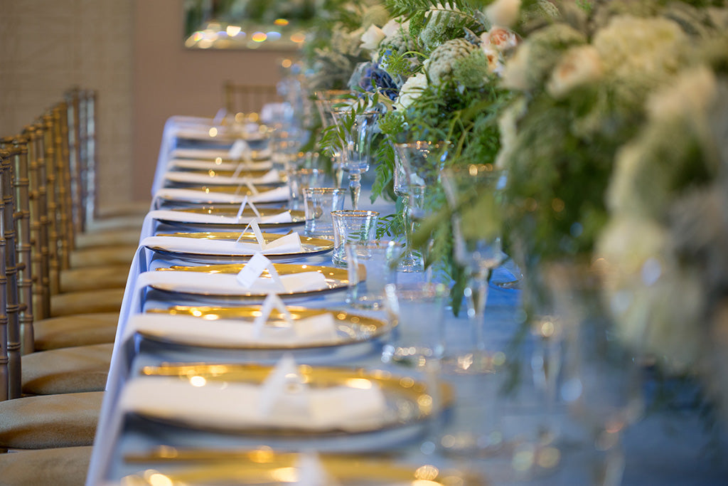 Wedding flowers decorate the table setting