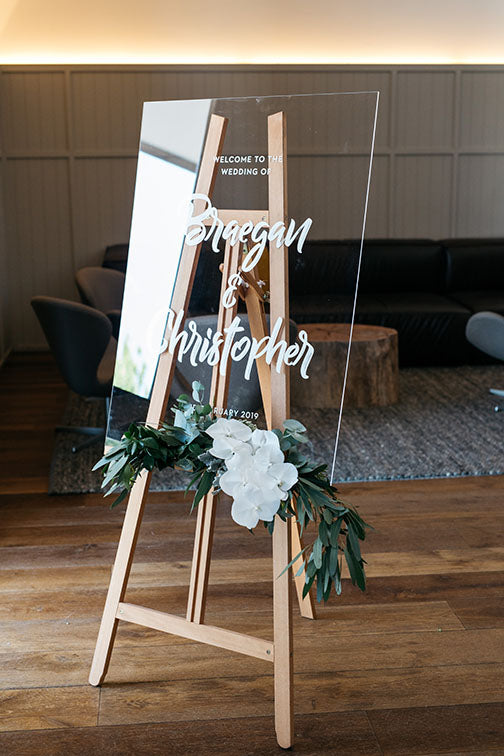 Entrance sign with flowers at wedding