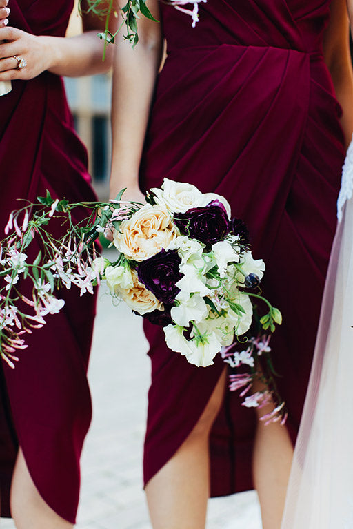 Bridesmaids holding Wedding Flower Bouquet at Wedding