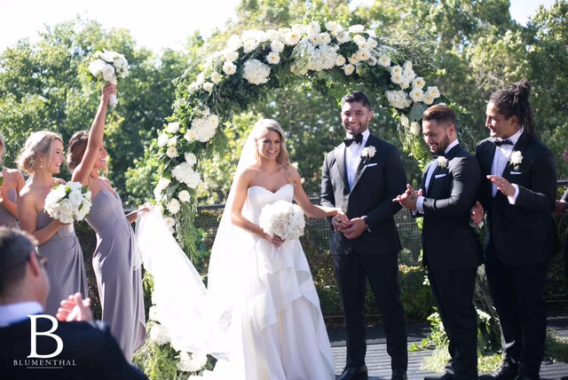 Bridal Party at Wedding Ceremony with Flowers