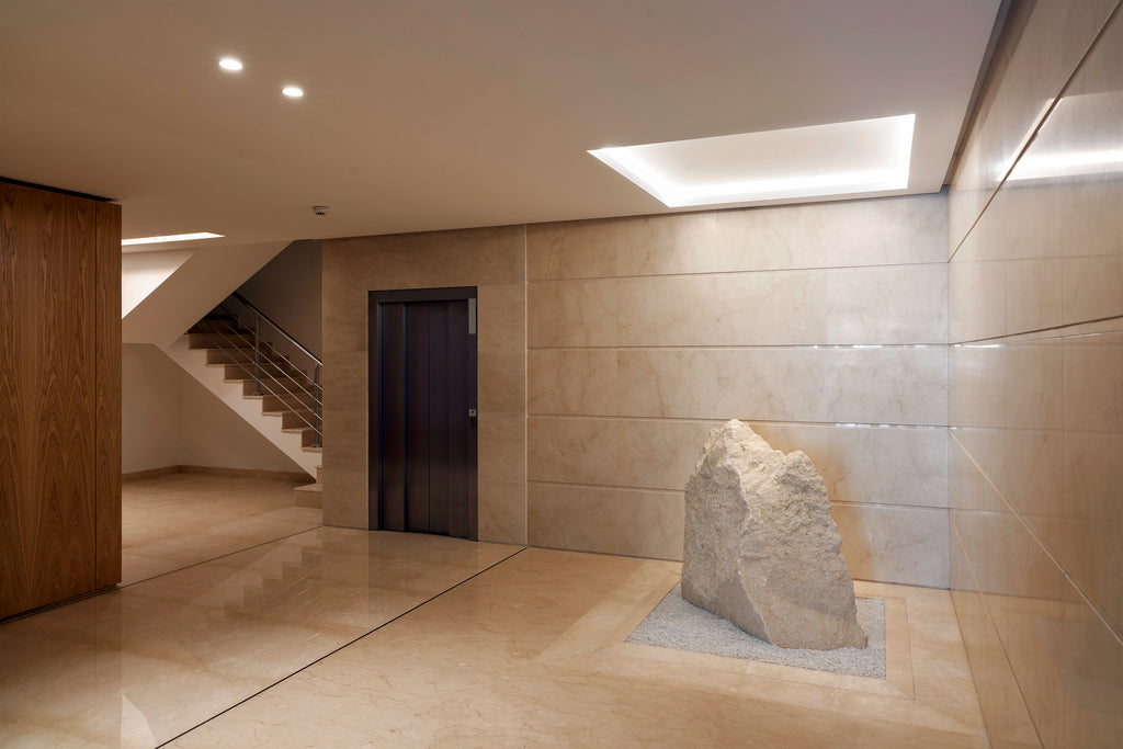 crema marfil floor and wall cladding entrance hall building Malta