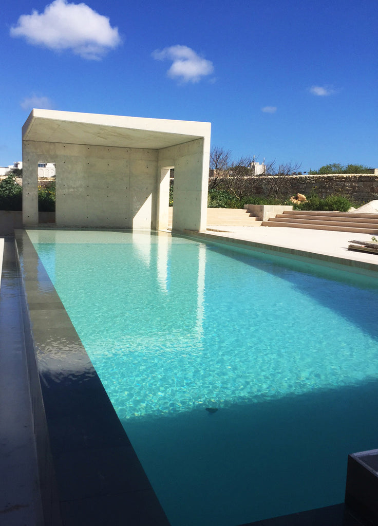 black slate travertine floor swimming pool residence Malta