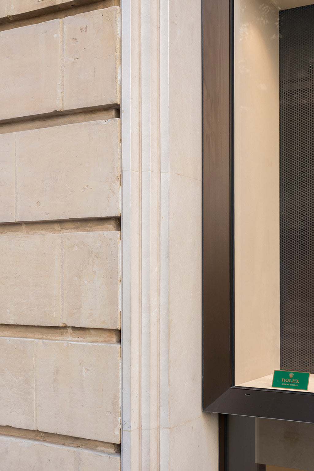 beige limestone window sill rolex store